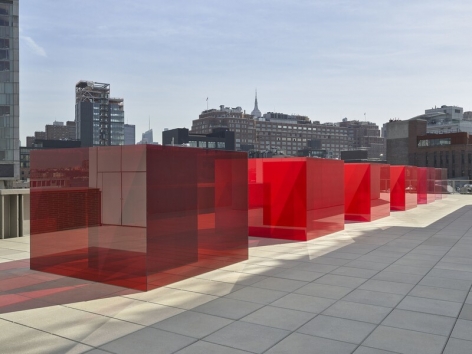 ALT="Larry Bell, Installation view of Pacific Red (V), 2017, Five laminated glass cubes"